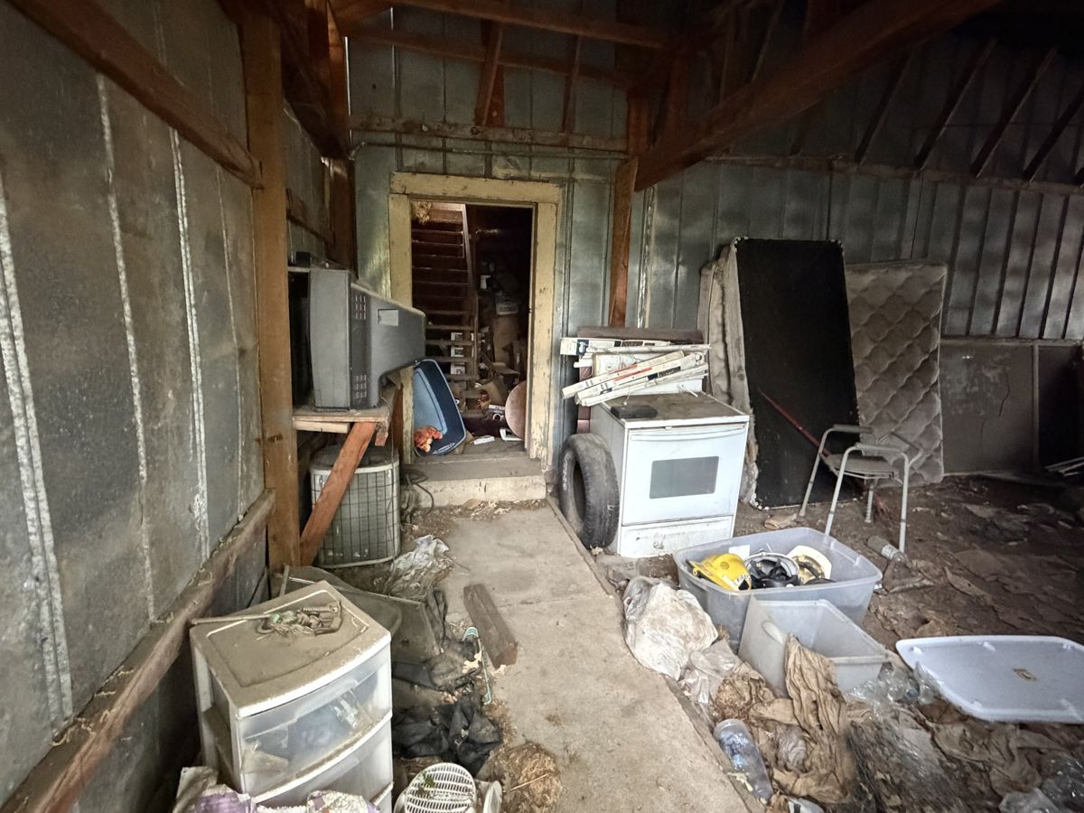 Cluttered shed and outbuilding ready for cleanout
