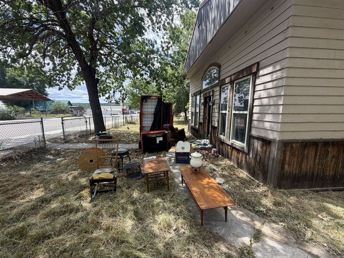 Side yard along a carport before junk removal